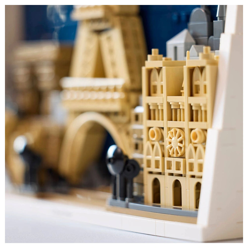 LEGO Architecture Paris model showcases a detailed cityscape with beige and gray bricks, featuring columns, arches, and windo