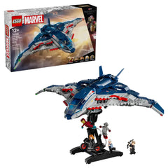 LEGO Avengers Quinjet set displayed with a sleek blue and gray aircraft featuring red details, accompanied by minifigures of Iron Man, Black Widow, and others. The box showcases the iconic Quinjet design with the Marvel logo and packaging elements.