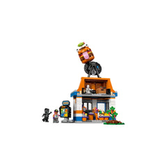 LEGO Fortnite Durrr Burger Restaurant set featuring a colorful building with a large burger on top. Includes action figures and a condiment station.