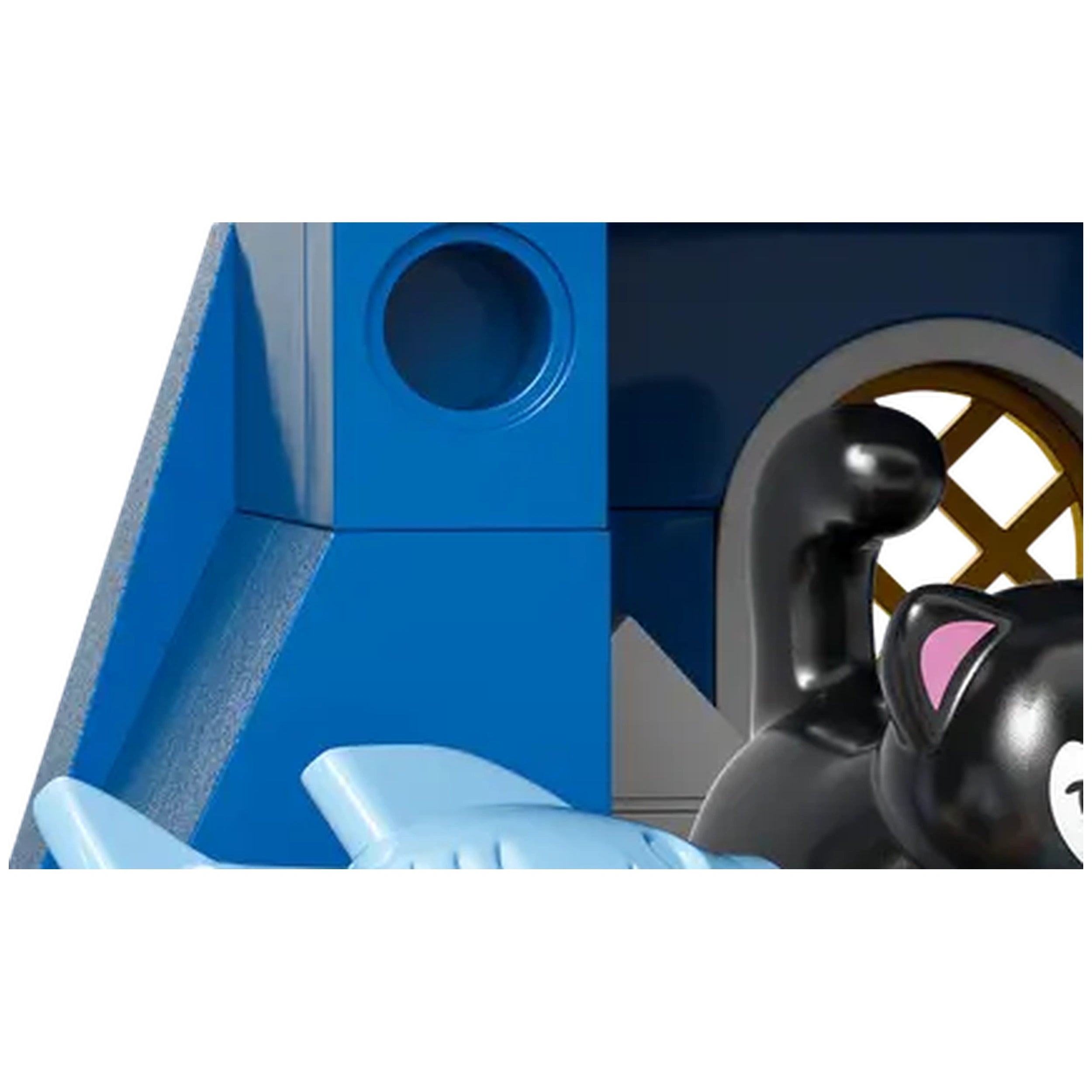 Black cat figurine with pink ears resting beside blue building blocks, featuring a circular opening and a window design.
