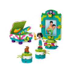 Colorful LEGO® set featuring a jewelry box adorned with flowers, a photo frame, and a Mirabel mini-doll holding a trophy.