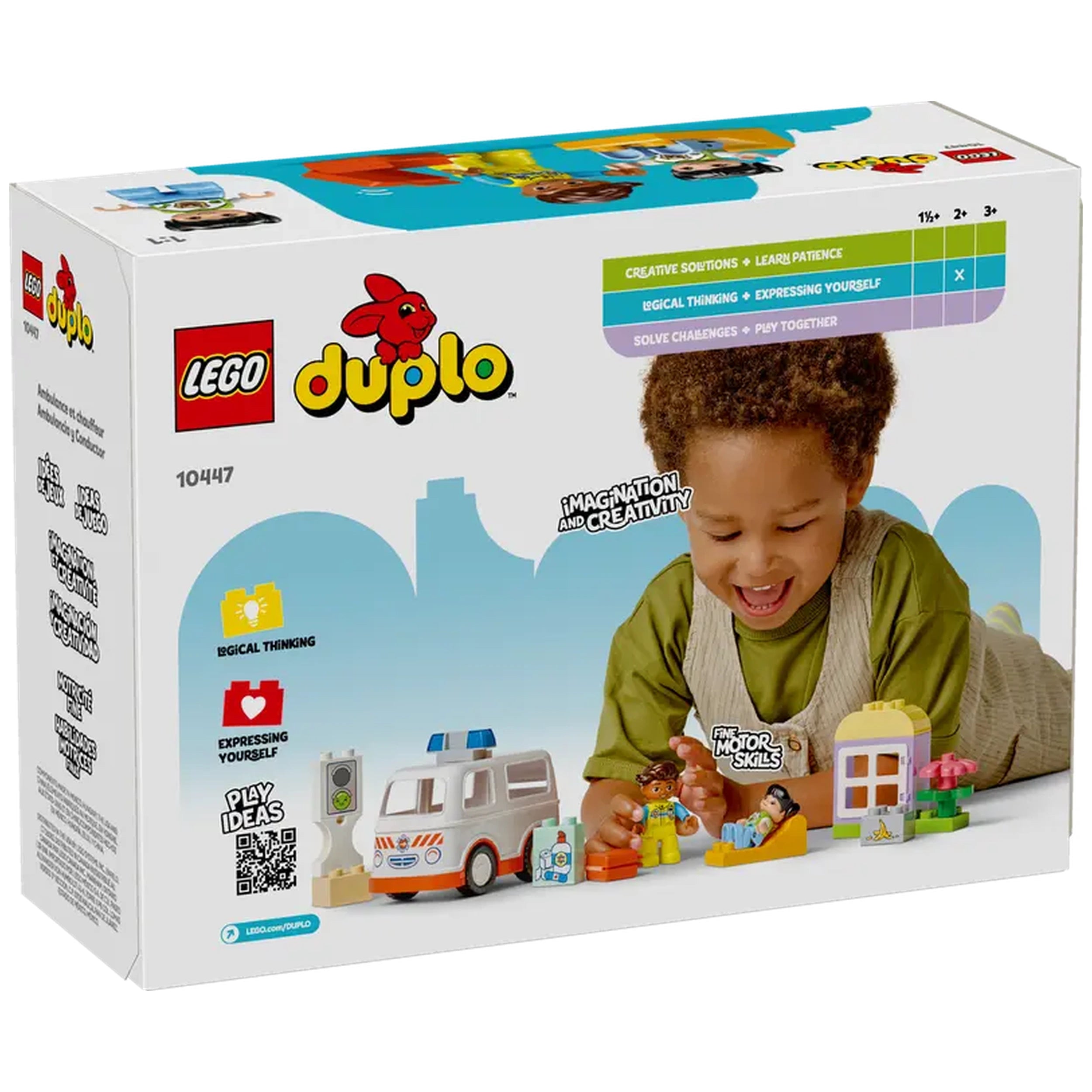 A young child smiles while playing with the LEGO® DUPLO® Ambulance & Driver set, featuring an ambulance, paramedic figure, and building elements, promoting creativity and imaginative play.