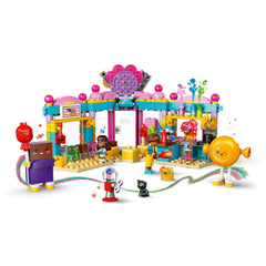 Colorful LEGO® Friends Heartlake City Candy Store with two mini-dolls, a cat figure, and vibrant candy displays, inviting imaginative play.