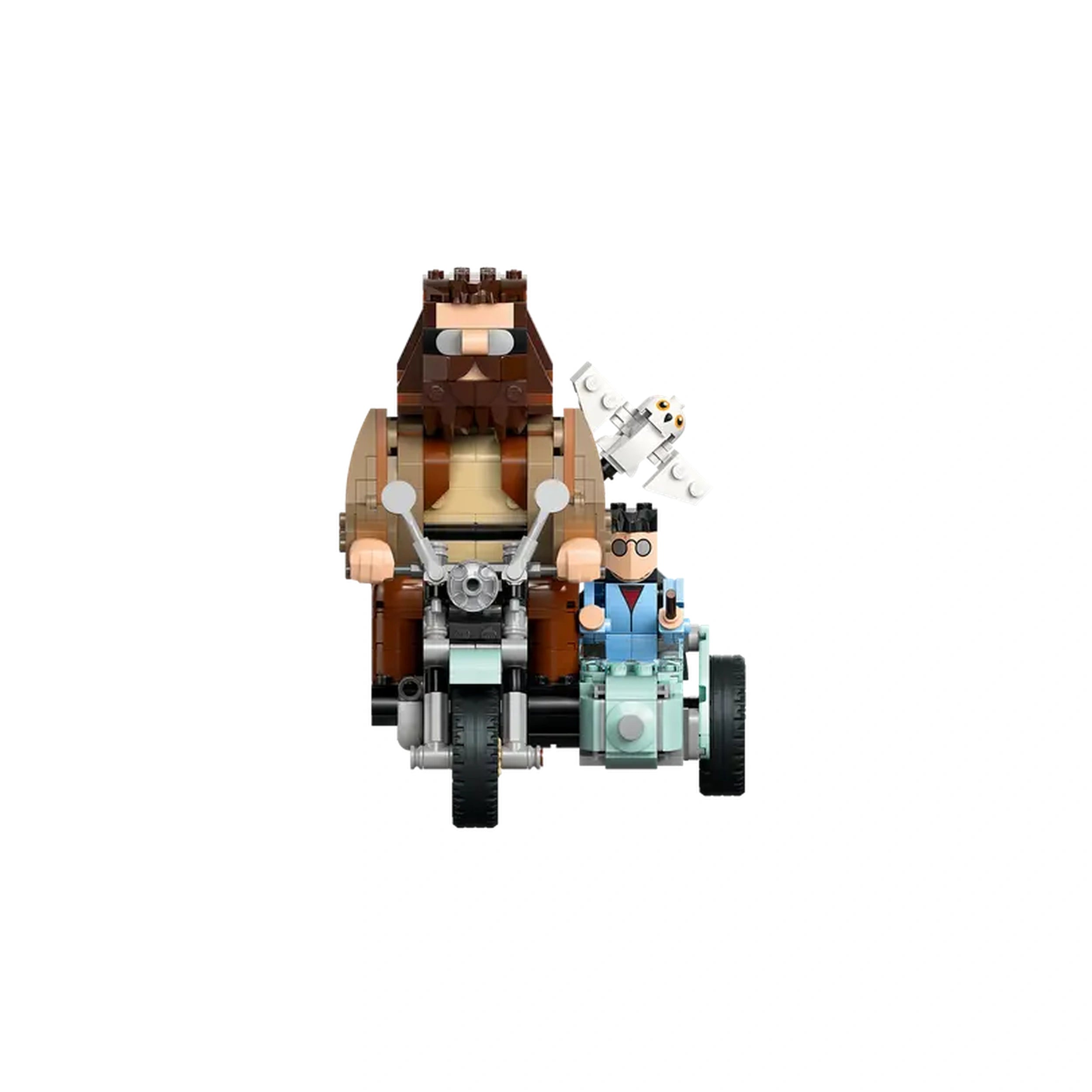 Hagrid and Harry Potter figures sit on a blue motorcycle with a sidecar, accompanied by Hedwig, against a white background.