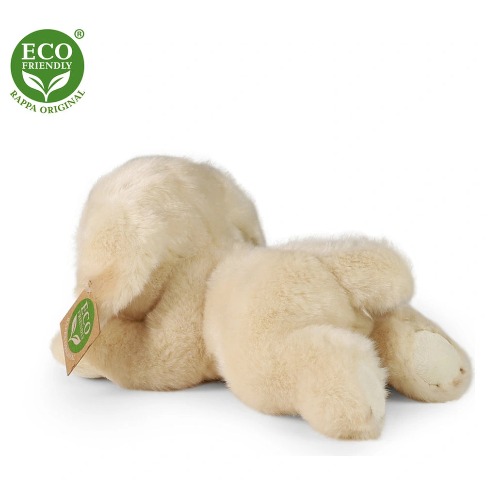 Eco-friendly plush golden Labrador teddy bear lying on its side against a plain white background, showcasing its smooth, ligh