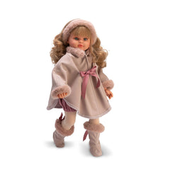 Doll in a pink cape, plush boots, and headband, with blonde curly hair and a delicate face.