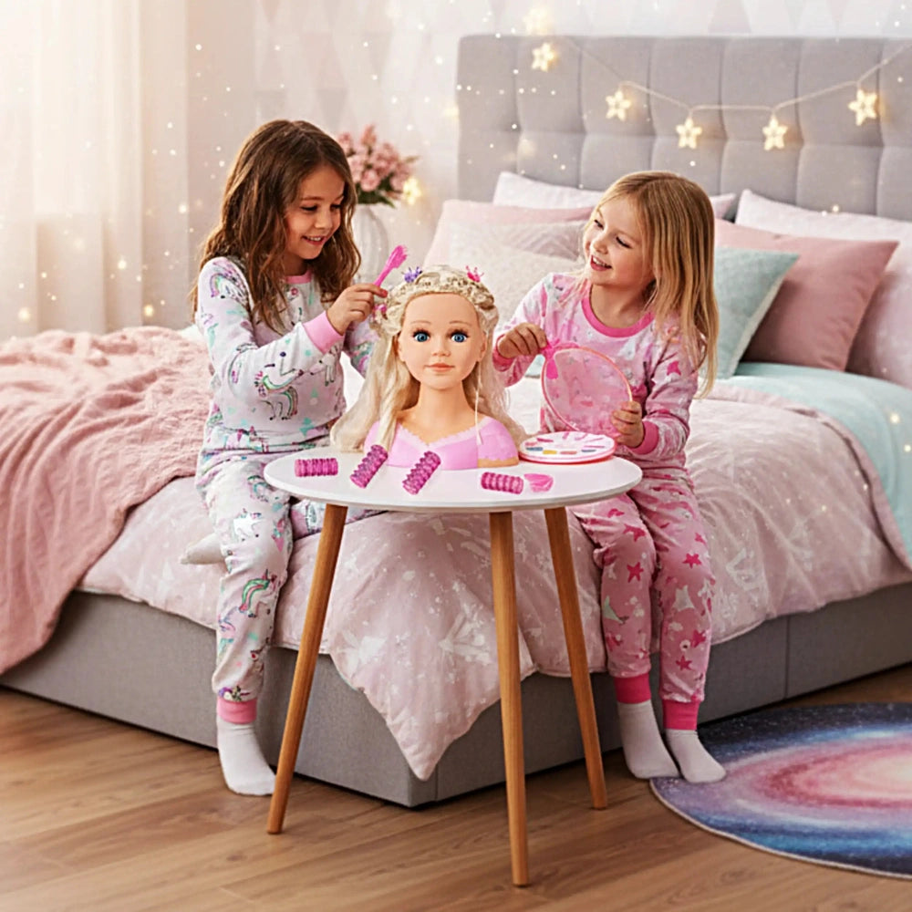 BAYER DESIGN Charlene Super Model dolls playset with two girls in pink pajamas, playing with a doll on a pastel pink bedsprea
