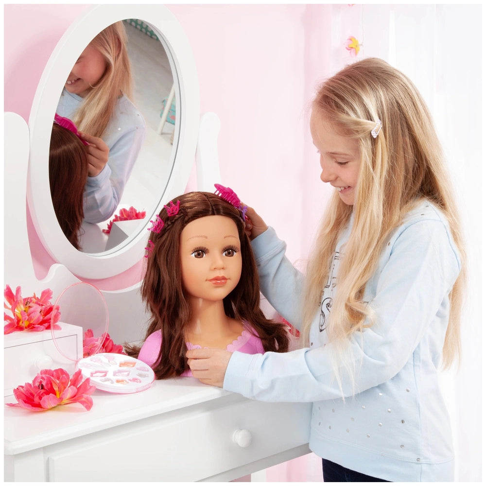 BAYER DESIGN Charlene Super Model doll in pink dress with white dresser, mirror, and pink flowers, as a young girl plays.