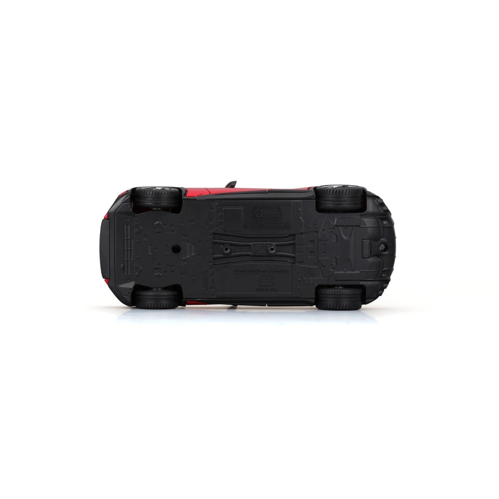 BBurago Ferrari Purosangue 1:24 die cast vehicle in black with matte finish, red stripe, wheels, and detailed components.