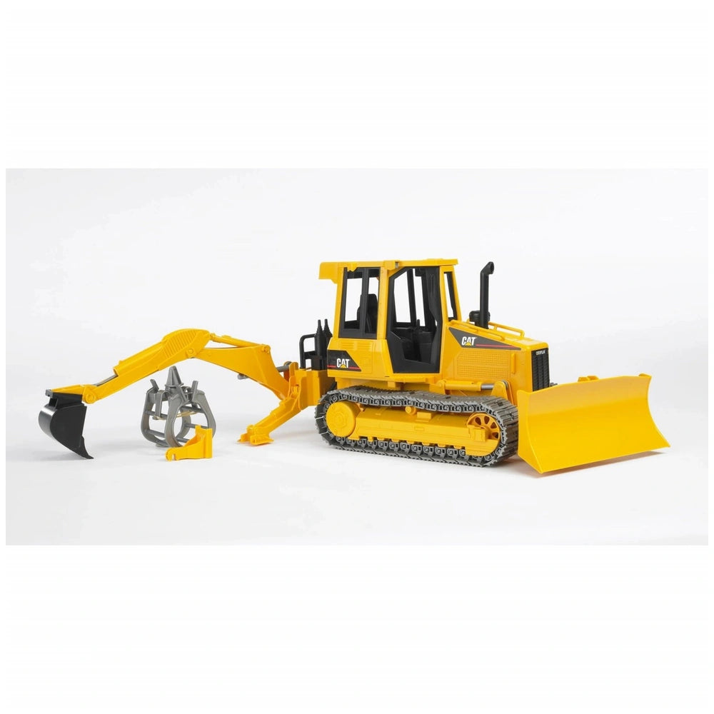 Yellow Bruder toy tractor with rear hydraulic arm and grabber attachment on white background.