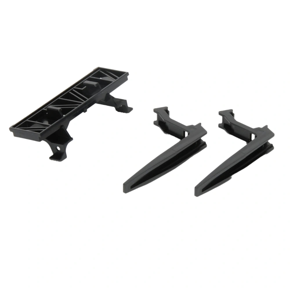 Black carrier plate with two detachable pallet forks for toy vehicles.