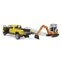 Yellow truck with open doors, a white trailer, and an orange mini excavator with a black scoop on tracks.