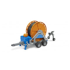 Bruder irrigation trailer toy with orange hose reel, blue base, and black wheels on a white background.