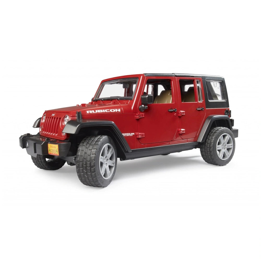 Red Bruder Jeep Wrangler Rubicon toy car with rugged tires and detailed design, viewed from the front-side angle.