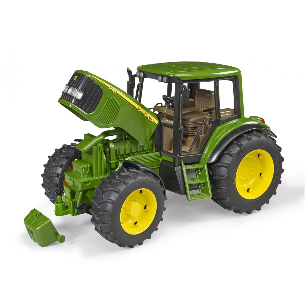 Green toy tractor with a front loader, yellow wheels, and an open hood, resembling a John Deere 6920 model.