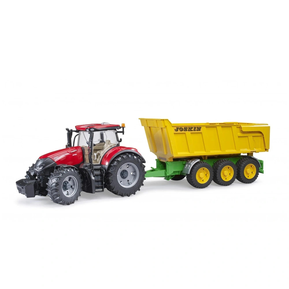 Red tractor with large black tires attached to a yellow Joskin tipping trailer with a green base, on a white background.