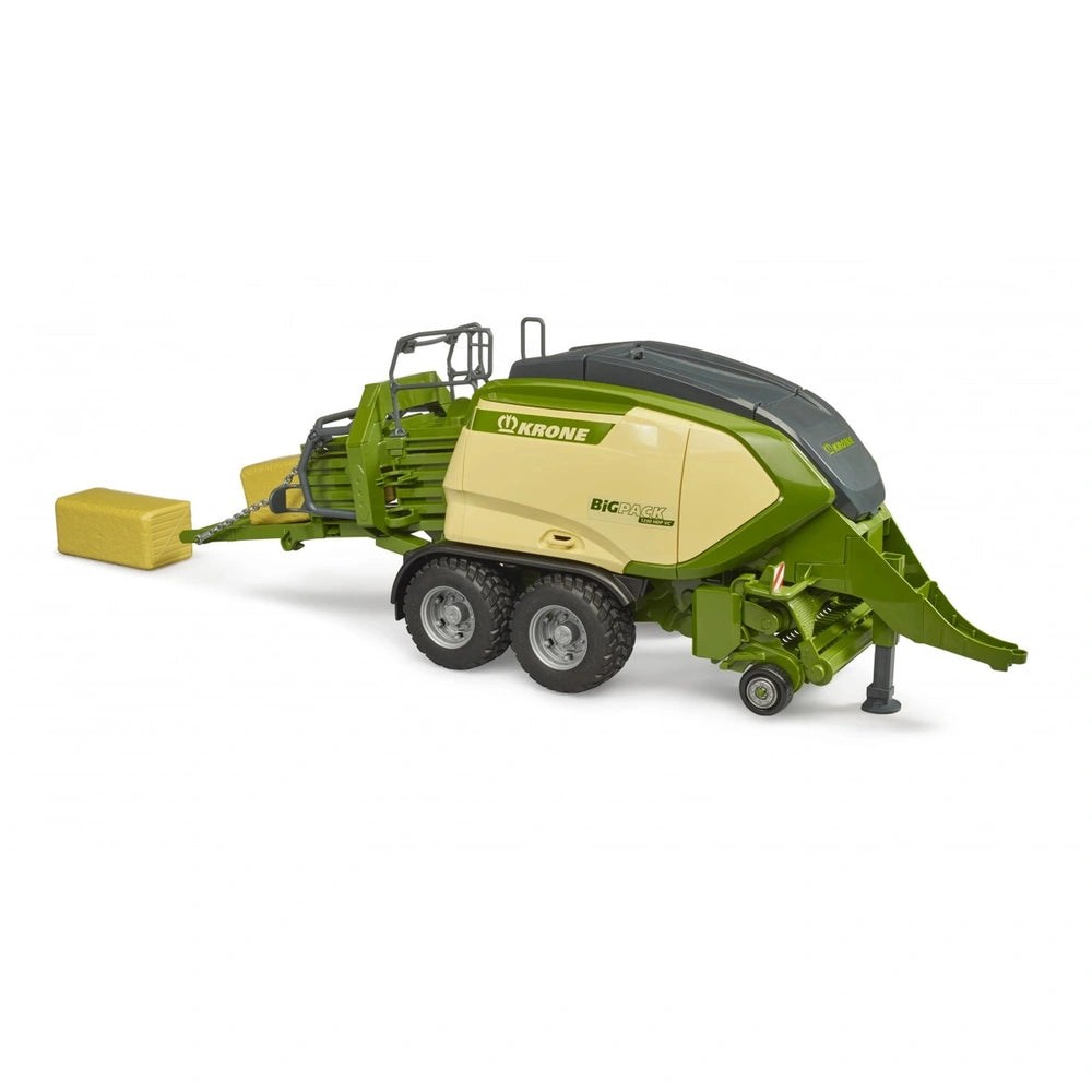 Bruder Krone BiG Pack 1290HDP VC toy baler with green and beige design, includes 2 block hay bales.