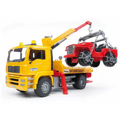 Yellow BRUDER MAN TGA breakdown truck with crane lifting red cross-country vehicle.