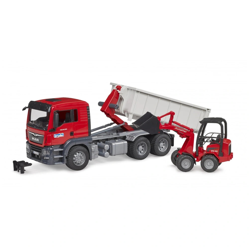 Red Bruder MAN TGS truck with roll-off container and Schäffer Yard Loader, showcasing construction play features.