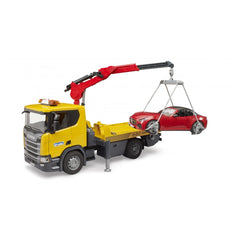 Yellow Bruder Scania tow truck with extendable red crane, lifting a red Bruder Roadster with loading harness.