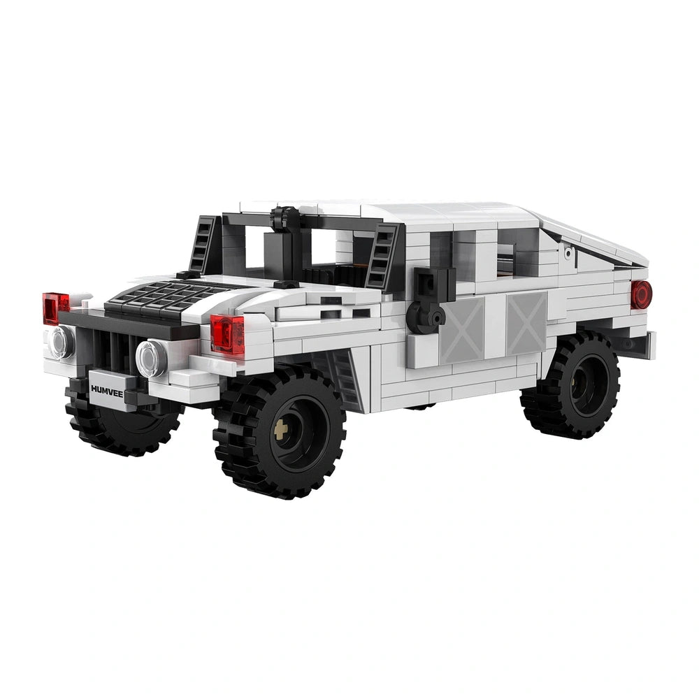 CaDA Humvee C-Series car made of white Lego bricks with black tires, red headlights, and black license plate.