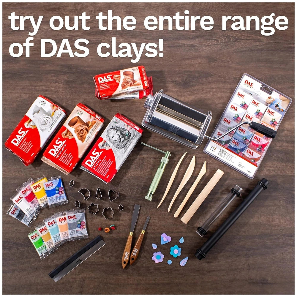 Das Modeling Clay in red and white packaging displayed on a wooden surface with scissors and paintbrush nearby.