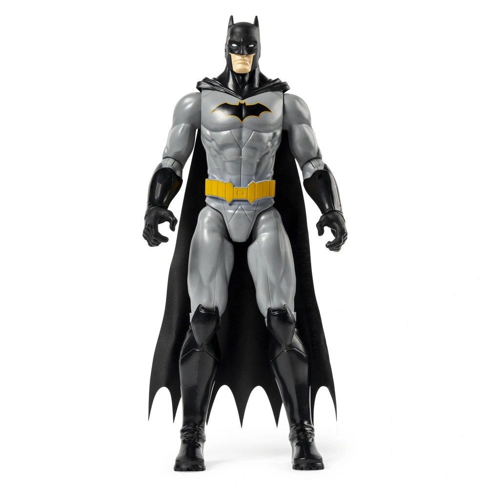 Batman Rebirth action figure stands in a dynamic pose, showcasing its grey bodysuit, black cape, and yellow emblem.