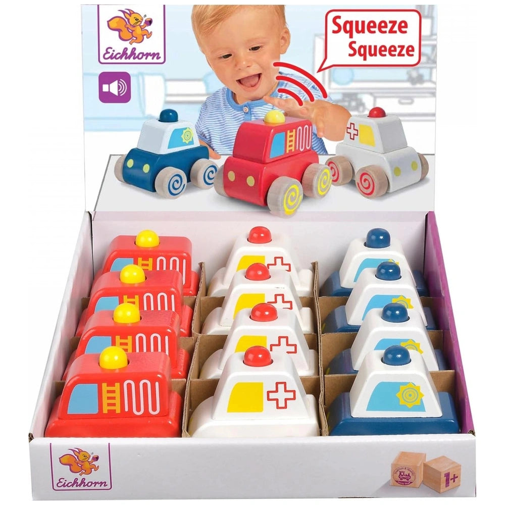Eichhorn baby emergency car toy set in colorful packaging features a joyful baby reaching for a red truck on a white surface.