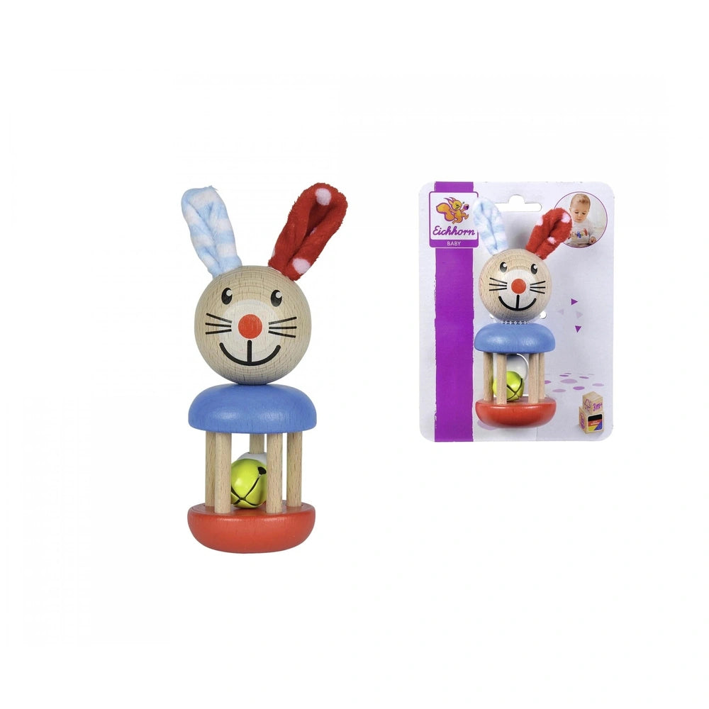 Baby wooden rattle rabbit with a smiling face, large ears, and a colorful design, displayed on a red base with packaging.