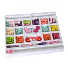 Eichhorn bead set featuring 190 colorful plastic and rubber pieces organized in a white compartmentalized tray.