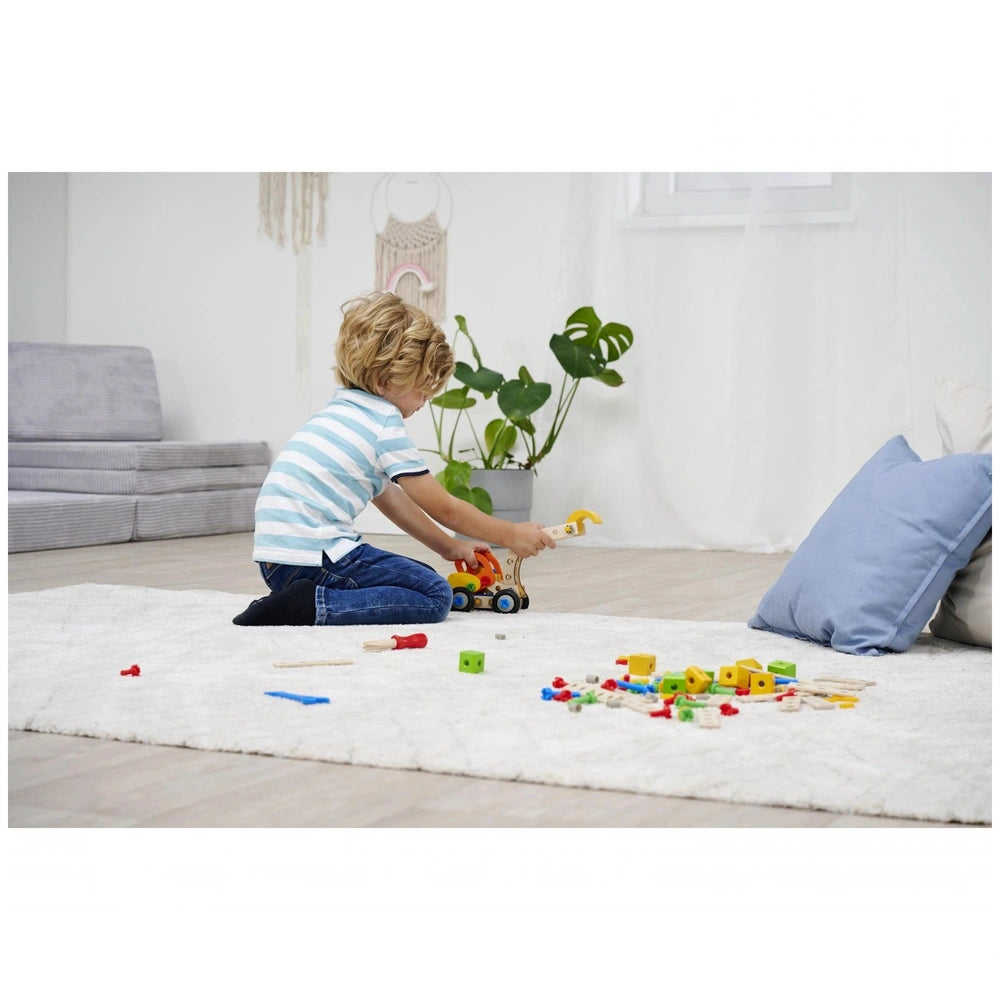 Eichhorn Constructor 3in1 construction set toys are being played with by a child on a white rug indoors.