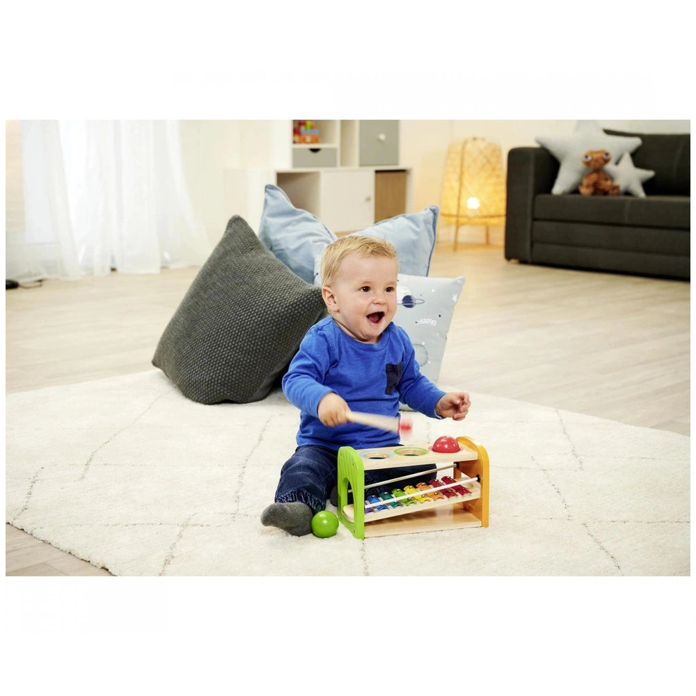 Eichhorn Hammer Bench with Xylophone displayed in a colorful, child-friendly modern living room, inviting musical play.