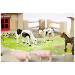 Eichhorn Little Farm Set features toy cows and a horse in a vibrant farm scene with a wooden fence and red building.