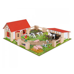 Eichhorn Little Farm Set featuring a red barn, various farm animals, green grass baseplate, and a welcoming wooden fence.