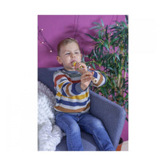 Eichhorn Music Wooden-Flute 32cm showcased with a smiling child holding a microphone in a cozy, colorful room.