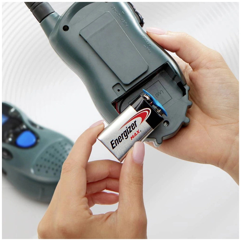 Energizer Max 6LR61 9V battery with blue cap, metallic silver casing, and recycling symbol, inserted in a handheld electronic