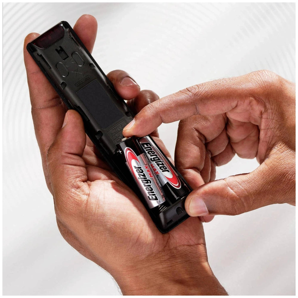 Energizer Max AA battery in black and red, displayed alongside a black phone case in a close-up view.
