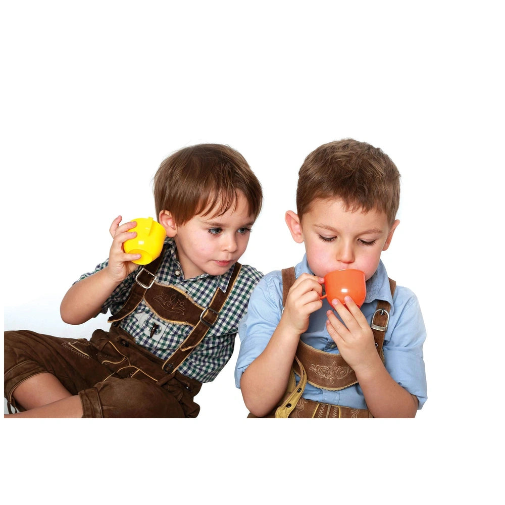 Gowi Coffee Service Paris set with two children in suspenders, holding colorful plastic cups in a playful lifestyle scene.