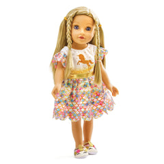 Glitter dress unicorn doll with long blonde hair, blue eyes, pink lips, floral dress, and white shoes with black and pink pat