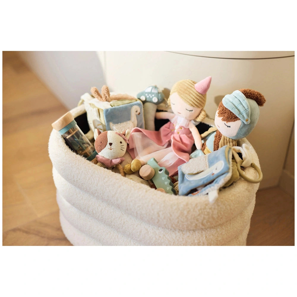 Jollein Activity Cube features a white plush basket on wooden floor, filled with colorful stuffed animals in various patterns
