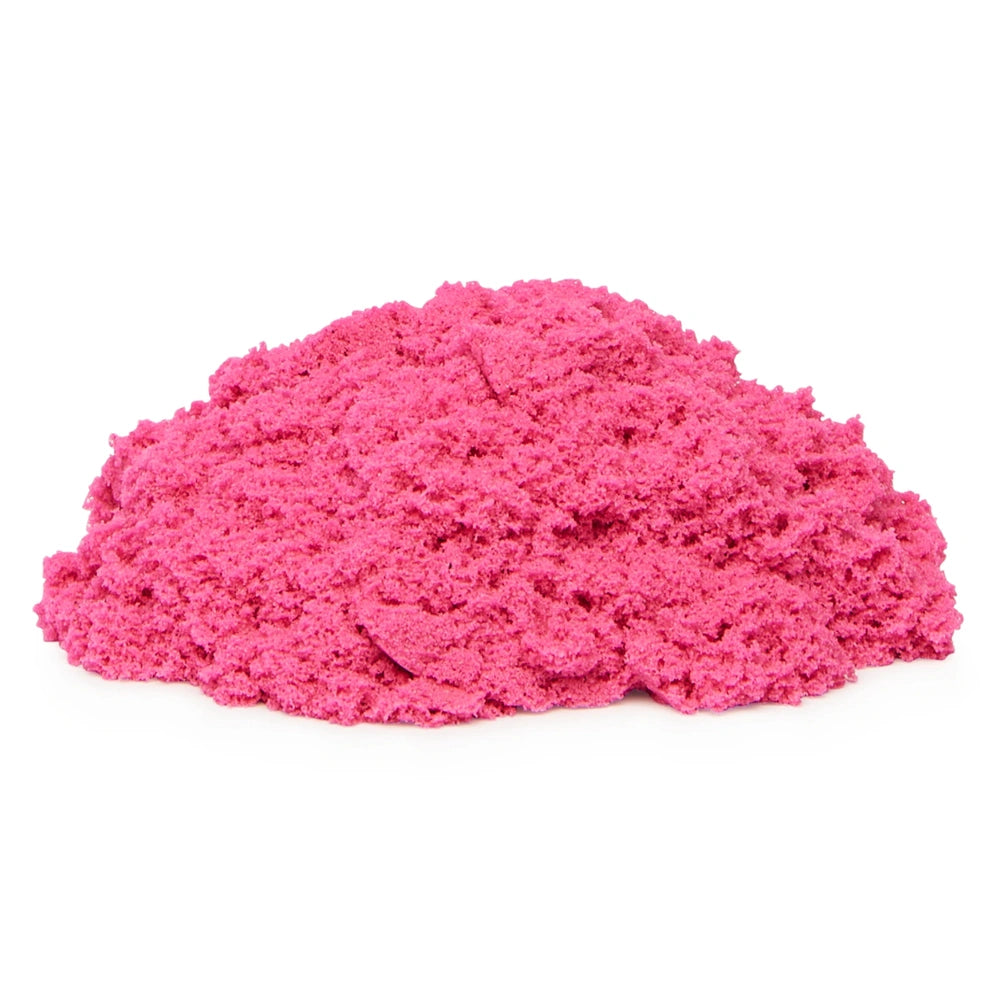 Kinetic Sand in a vibrant pink hue, showcasing its fine texture and irregular pile against a white background.