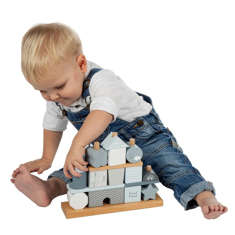 Label-Label stacking blocks house toy held by a young child in blue overalls, featuring various shapes and a "label love" ins