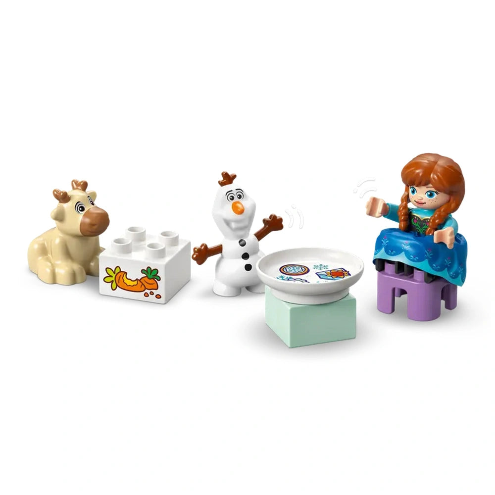 LEGO Anna and Elsa's Frozen Castle Party set features three colorful figures interacting with a decorated blue Lego plate.