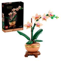 LEGO® Botanicals Mini Orchid set featuring five peach blooms, green leaves, and a terracotta pot on a wood-effect base, with the box in the background.