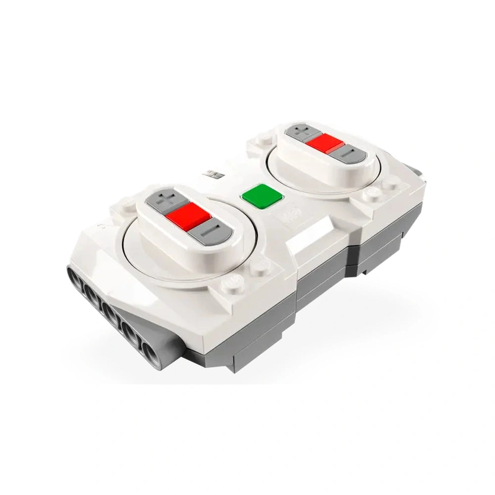 White LEGO component featuring two circular controls with red and gray buttons, and a green indicator light, designed for the LEGO City Express Passenger Train set.