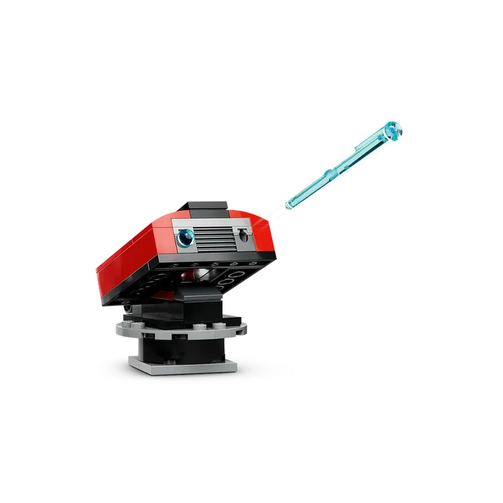 Bright red toy fire truck with a blue water hose attached, positioned on a black base, showcasing intricate design details.