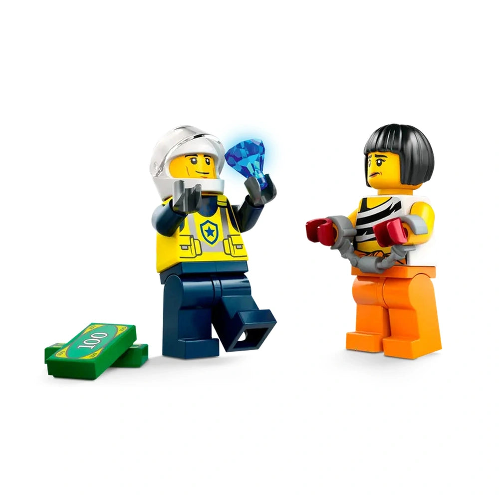 Two LEGO minifigures in a playful standoff; the police officer in blue and yellow holds a blue diamond, while the crook in an orange outfit glares, wearing handcuffs. A stack of green cash lies nearby.