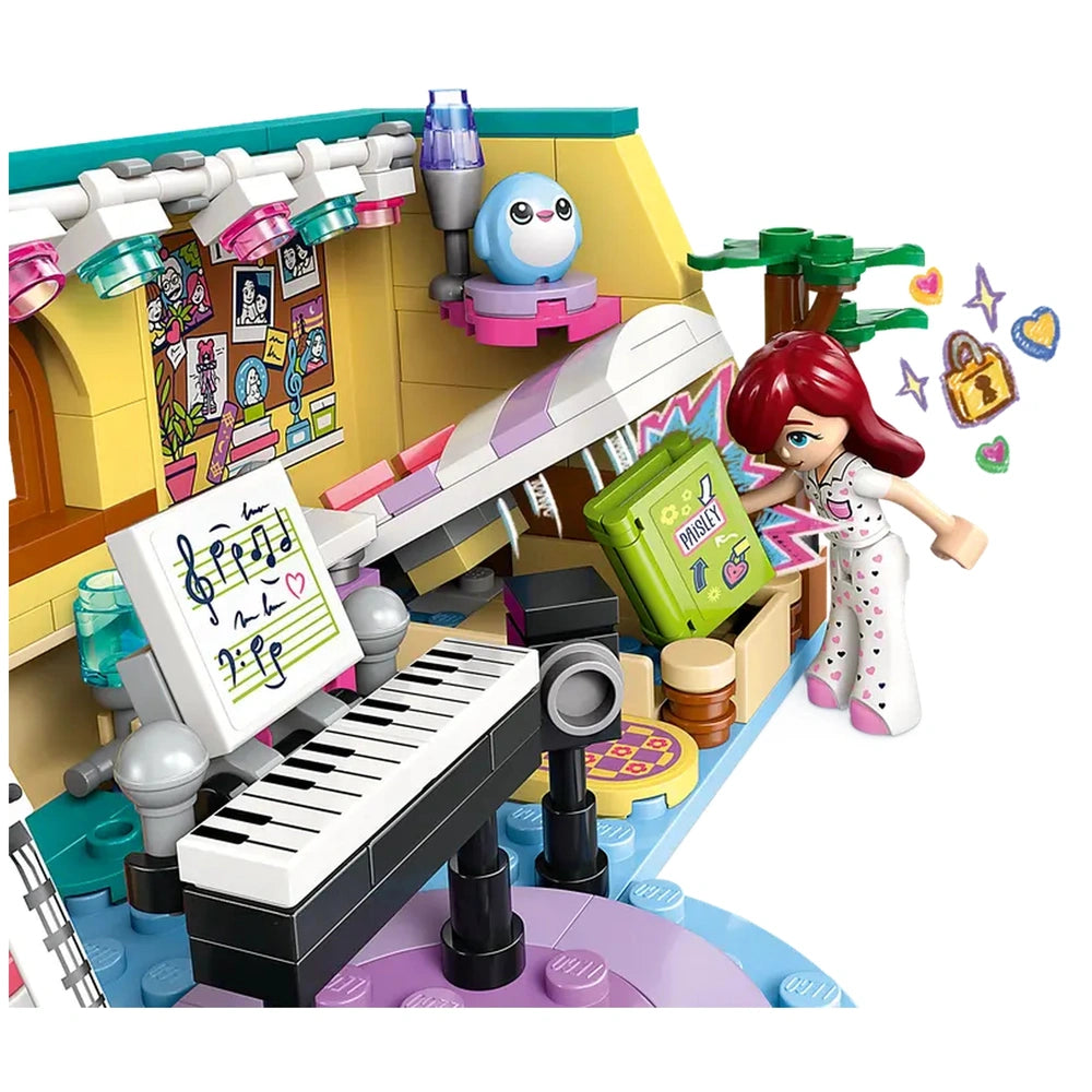 LEGO Friends Paisley’s Room construction set showcasing a colorful interior with a piano, music notes, and Paisley minidoll exploring a vibrant drawer.