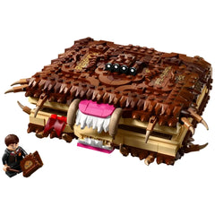 LEGO Harry Potter Chomping Monster Book of Monsters set featuring a brown brick-built book with fangs and a character holding a wand.