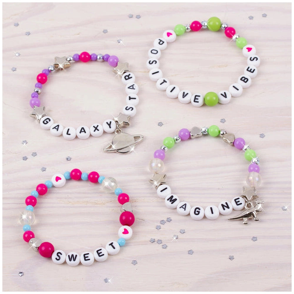 Block ‘N’ Rock Bracelets in pink, purple, green, and blue with starfish charms and cursive text "Galaxy", "Star", "Positive",